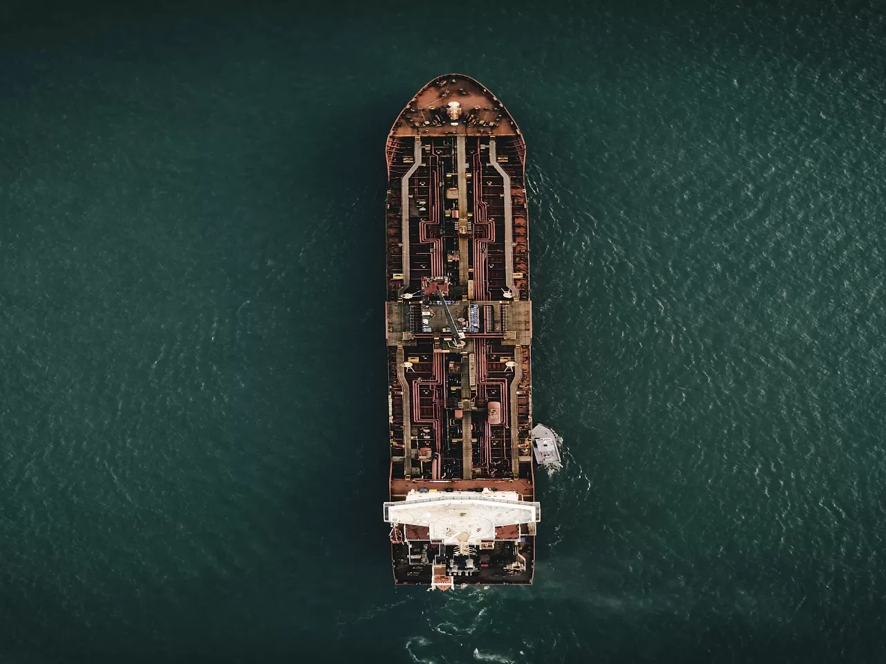 aerial view of a marine vessel in the middle of the sea
